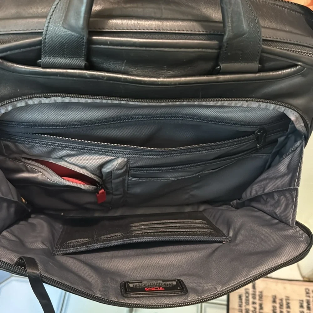 TUMi black leather computer briefcase carry-on VGC long strap multiple pockets